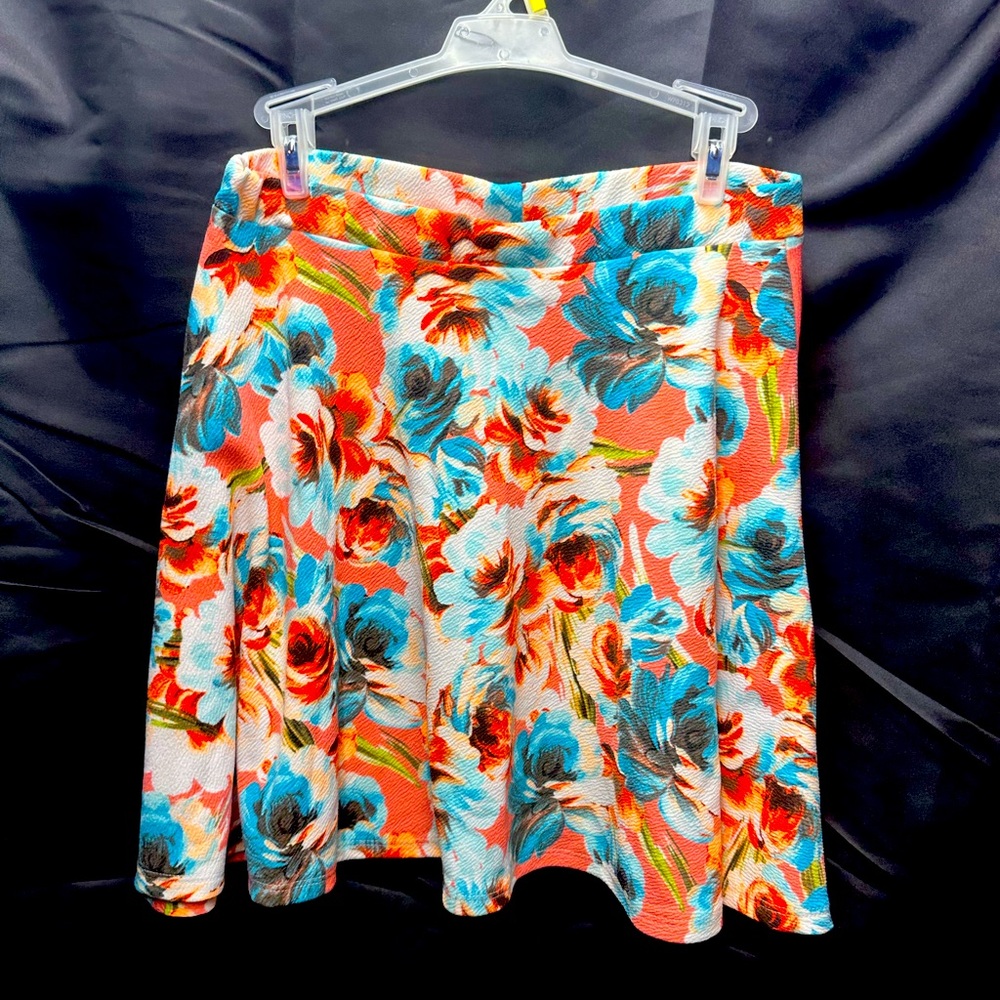 #1142 White Mark size XL, skirt length is 16”, colors are peach blue orange.